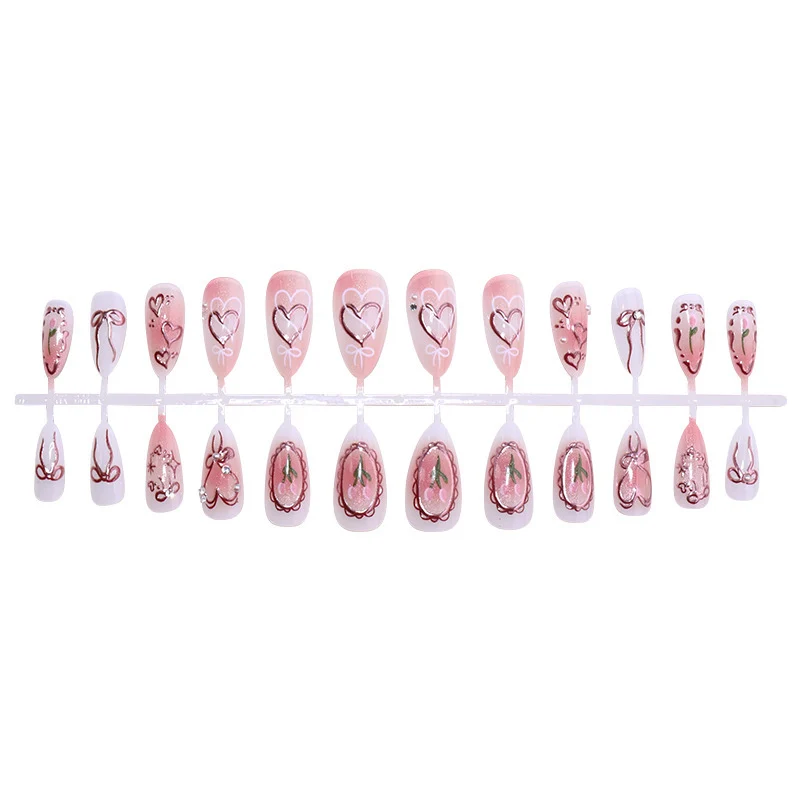 Kunstnagelset mit romantischen Herzen und Schleifen-Design Karnz