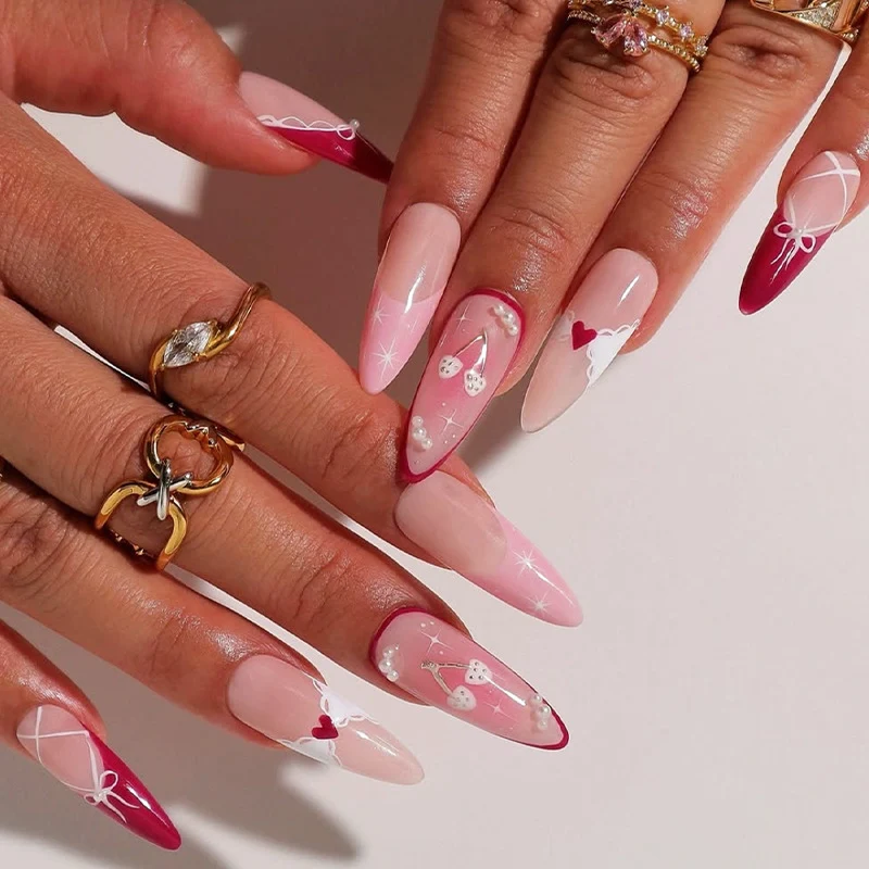 Kunstnagelset mit romantischen Herz- und Schleifenmotiven Karnz