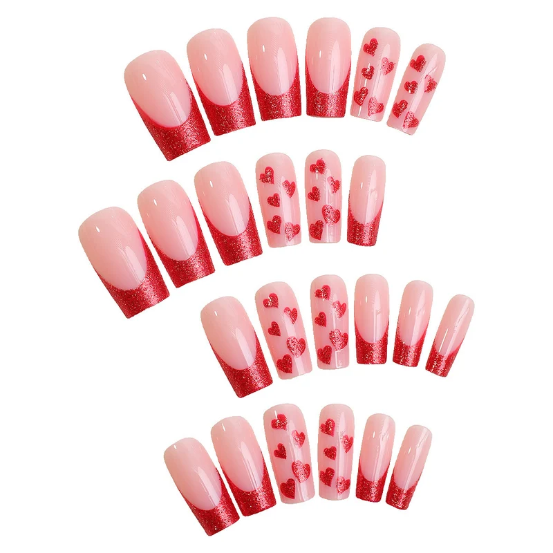 Kunstnagelset mit glamourösen Herzmotiven und Glitzerakzenten Karnz