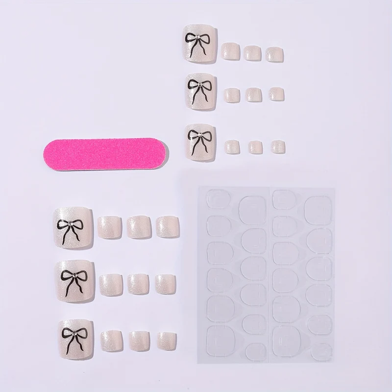 Kunstnagelset mit funkelnden Akzenten und eleganten Schleifen Karnz