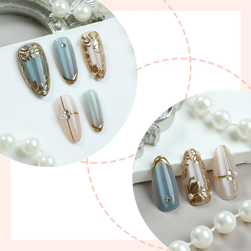 Kunstnagelset mit floralen Goldverzierungen Karnz
