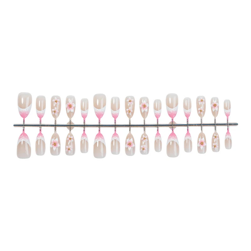 Kunstnagelset mit floralen Designs Karnz