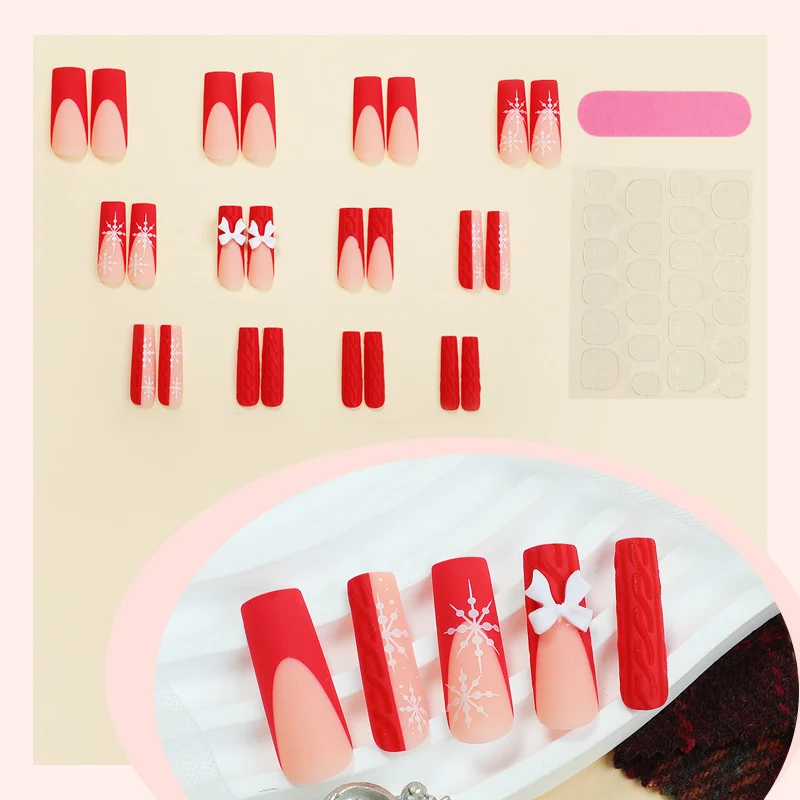 Kunstnagelset mit festlichen Schneeflocken- und Schleifenmotiven Karnz