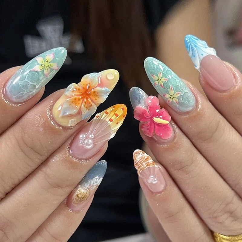 Kunstnagelset mit farbenfrohen Blumen- und maritimen Designs Karnz