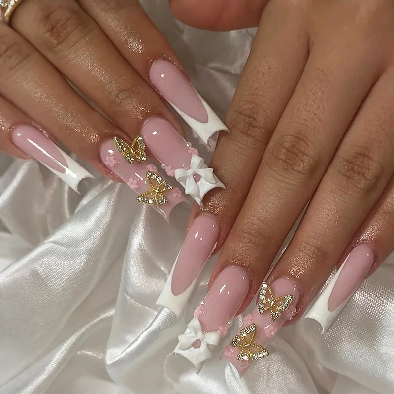 Kunstnagelset mit eleganten Schmetterlings- und Schleifenakzenten Karnz