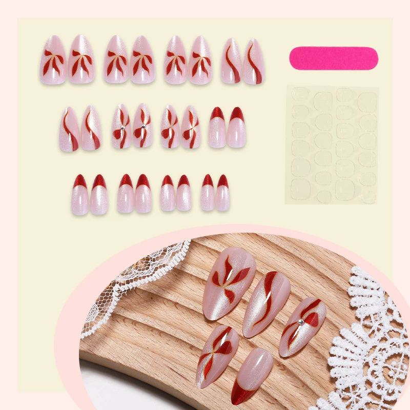 Kunstnagelset mit eleganten Schleifen- und Glitzerakzenten Karnz