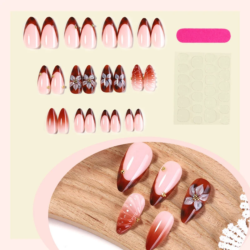 Kunstnagelset mit detailliertem Ombre-Design und kreativen Blütenakzenten Karnz