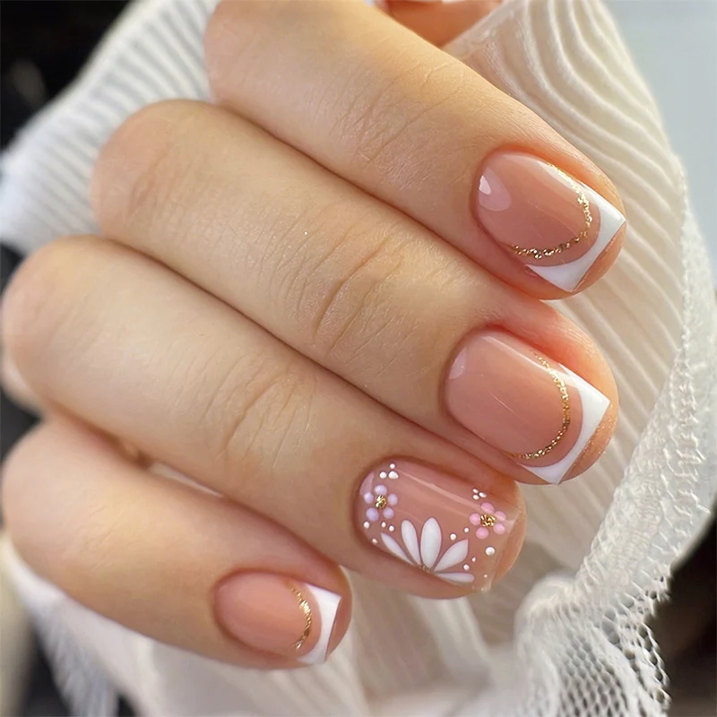 Kunstnagelset mit bunten Blüten und kreativem French-Design Karnz