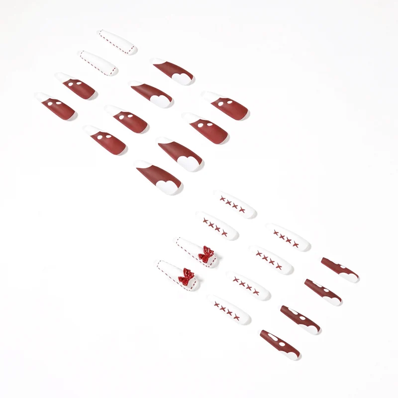 Kunstvolle Stiletto-Nägel mit Schleifen- und Zickzackdesign Karnz