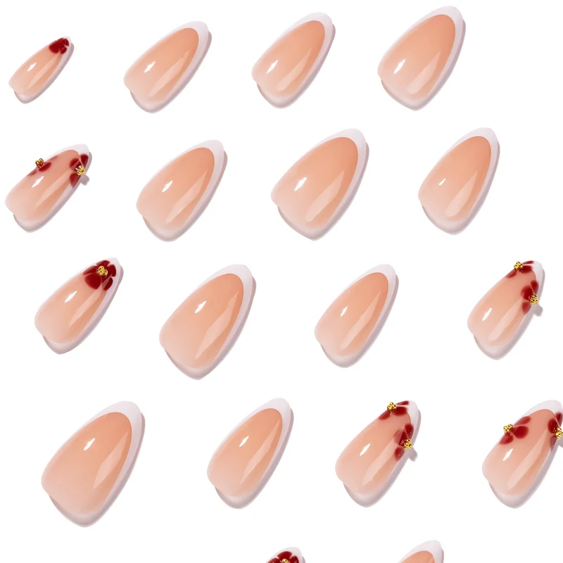 Kunstvolle Stiletto-Nägel mit luxuriösem floralem Design Karnz