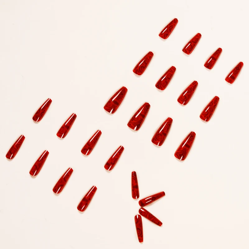 Kunstvolle Stiletto-Nägel mit floralem 3D-Design Karnz