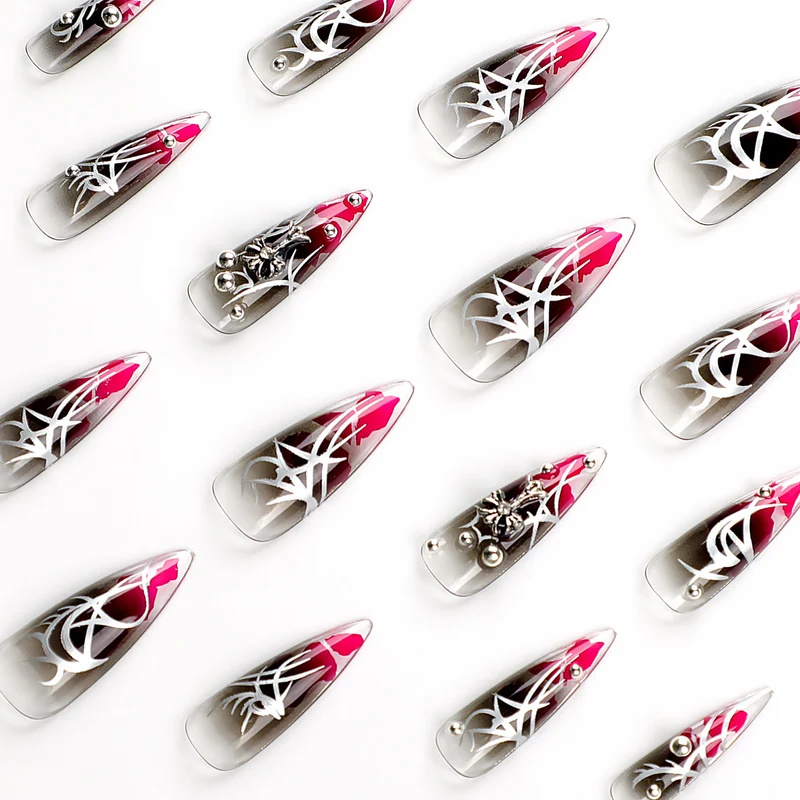 Kunstvolle Stiletto-Nägel mit eleganter Dekoration und modernen Akzenten Karnz