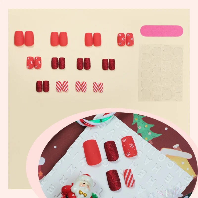 Kunstnagelset im festlichen Rot mit Glitzer- und Weihnachtsmotiven Karnz