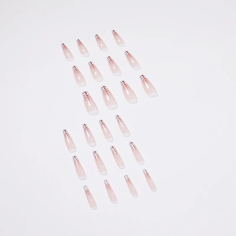 Kunstvolle Nagelverlängerungen mit eleganten Dots und schimmerndem Ombré Karnz