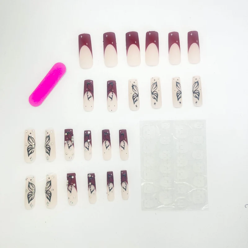 Künstlerische Lange Nagelverlängerungen mit Schmetterlingsdesign Karnz