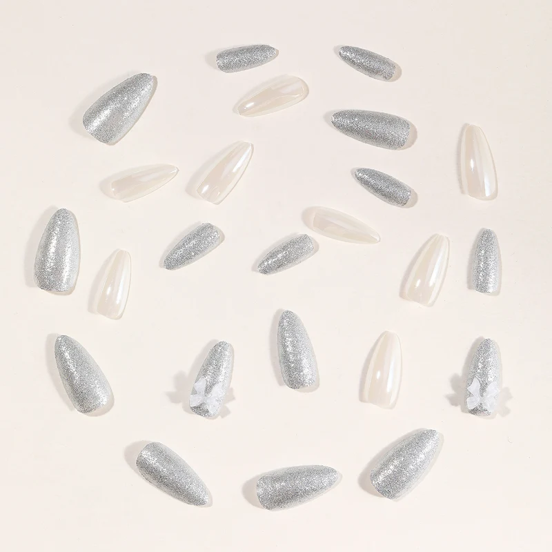 Elegante Stiletto-Nagelkunstverlängerungen mit 3D-Schleifenakzenten Karnz