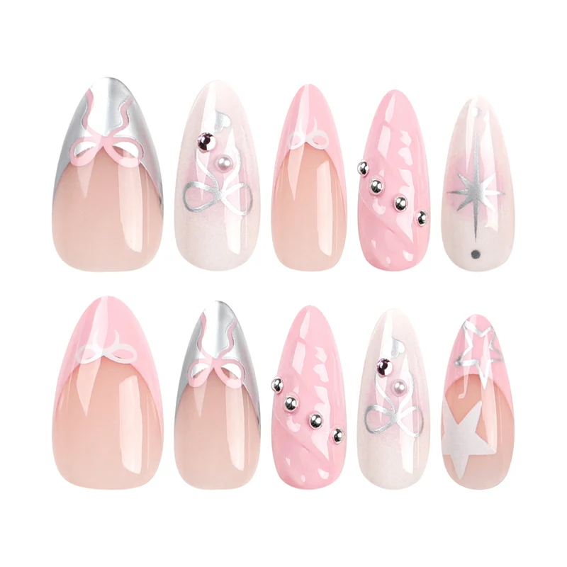 Kunstvolle Nagelkunst mit dekorativen Schleifen und Glitzerakzenten Karnz