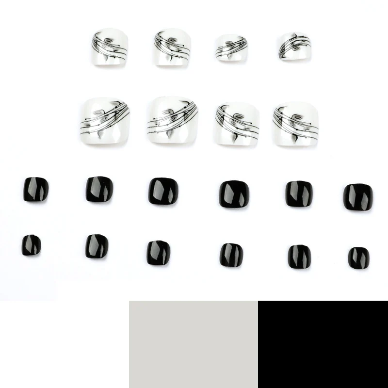Kunstvolle Fußnagelkunst im eleganten Schwarz-Weiß-Design Karnz