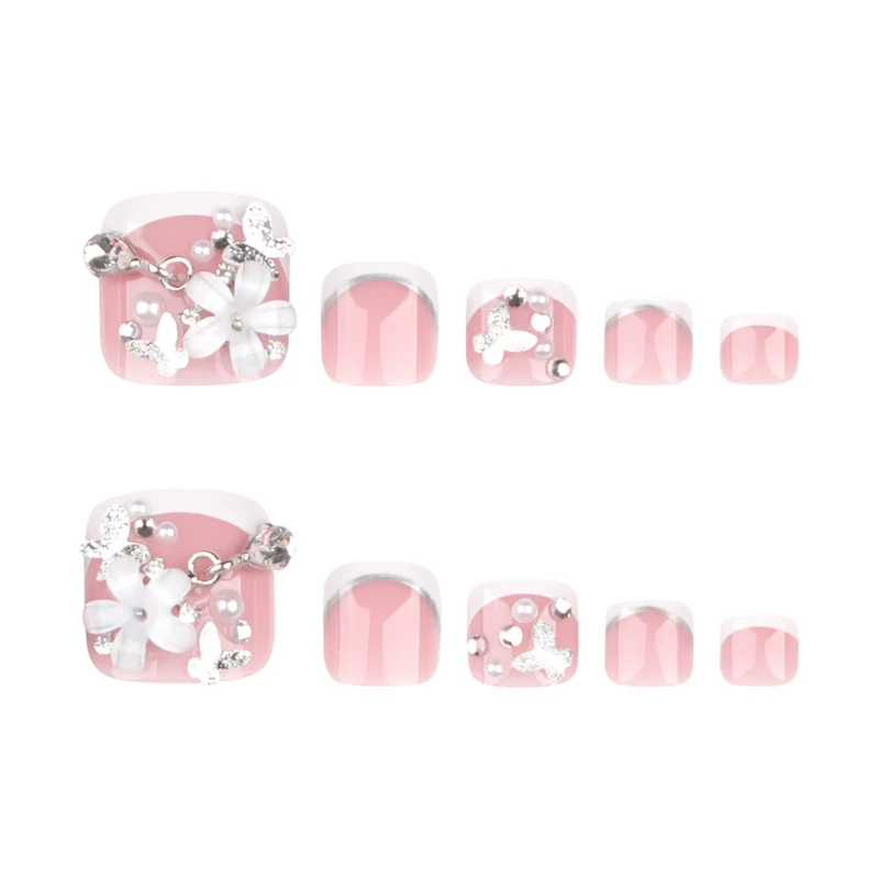 Kunstvolle Fußnagelgestaltung mit eleganten Blüten- und Glitzerakzenten Karnz