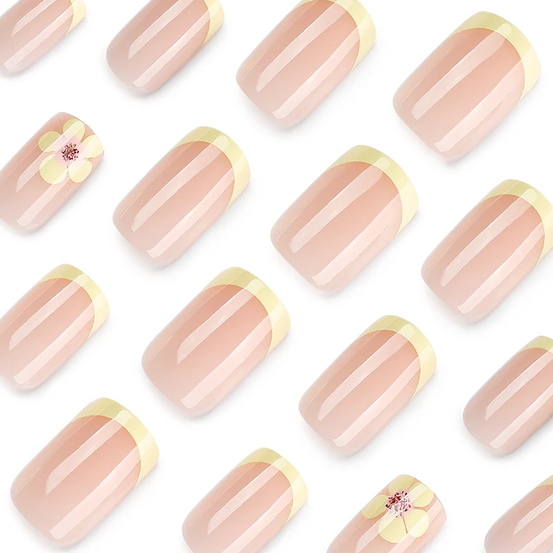 Kunstvolle French-Tip Nägel mit Blumenverzierungen Karnz