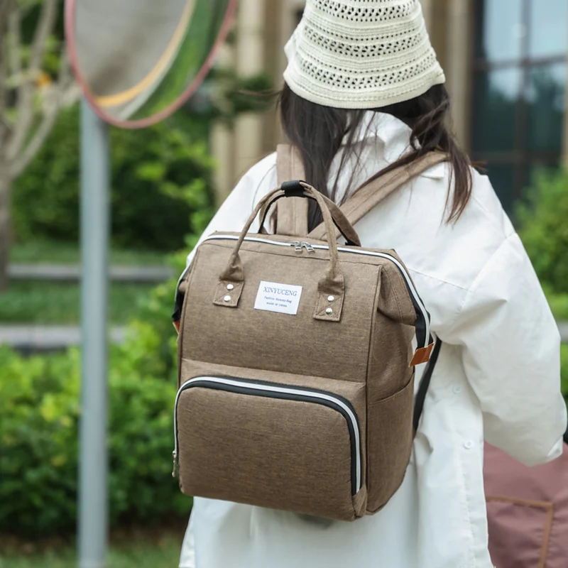 Multi-Taschen Baby Pflege Rucksack Karnz