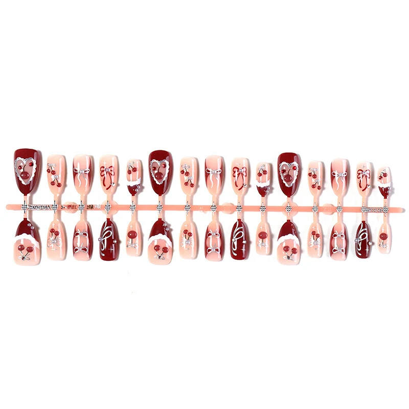Kreatives Kunstnagelset mit romantischen Herz- und Schleifenmotiven Karnz